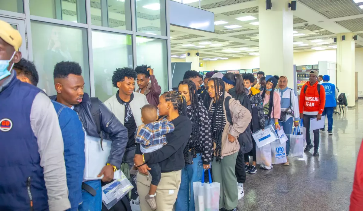 A picture of 91 refugees arriving in Rwanda