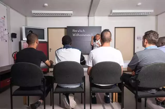 A picture of refugees happily learning